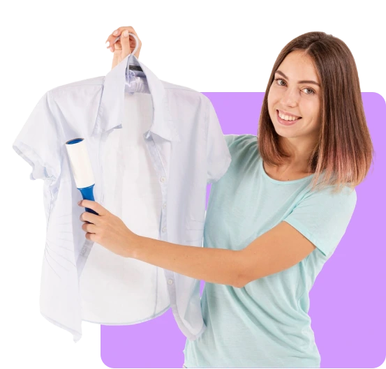 girl holding a shirt hanging on a dress hanger